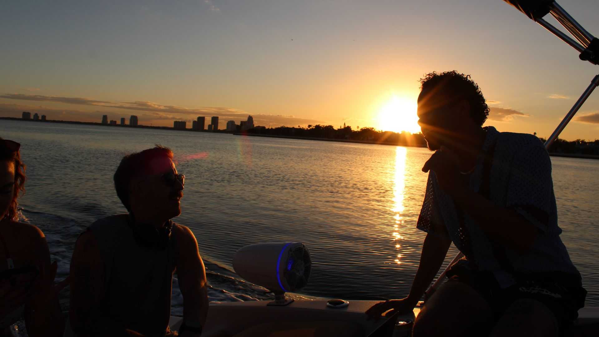 Group celebrating on a sunset boat cruise near Davis Island in Tampa Bay, FL.